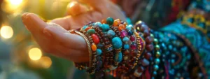 a person wearing gemstone bracelets with colorful stones.