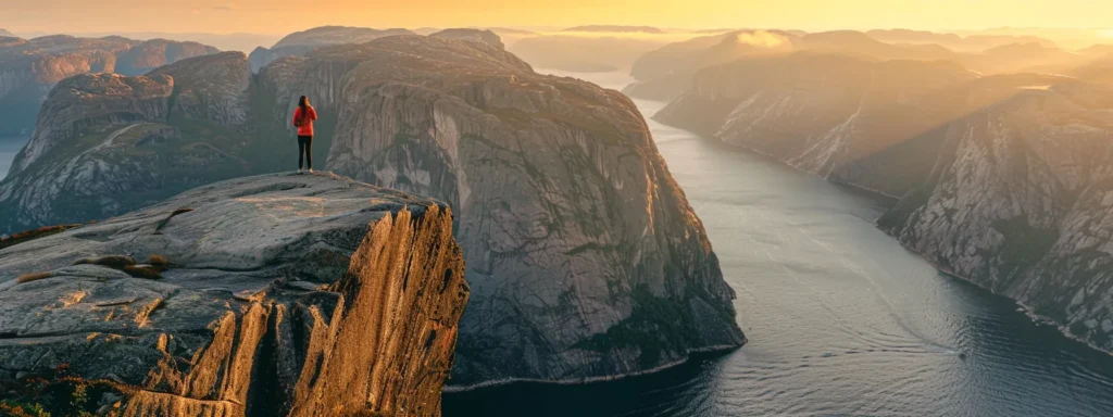 a woman standing confidently at the edge of a cliff overlooking a vast, inspiring landscape.