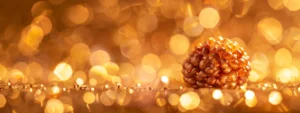 a close-up photo of a twelve-faced mukhi rudraksha bead set against a glistening golden backdrop, radiating a sense of ancient mysticism and spiritual power.