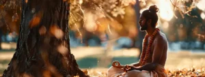 a serene yogi meditating under a tree with a gleaming thirteen mukhi rudraksha necklace around his neck, emanating a powerful aura of spiritual energy.